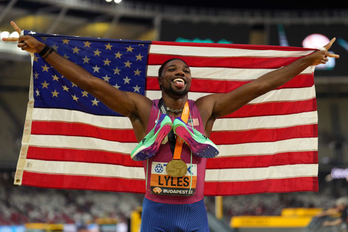 Budapest, Hungary; Noah Lyles (USA) poses for photographs after winning the mens 200m race during the 2023 World Athletics Championships at National Athletics Centre.